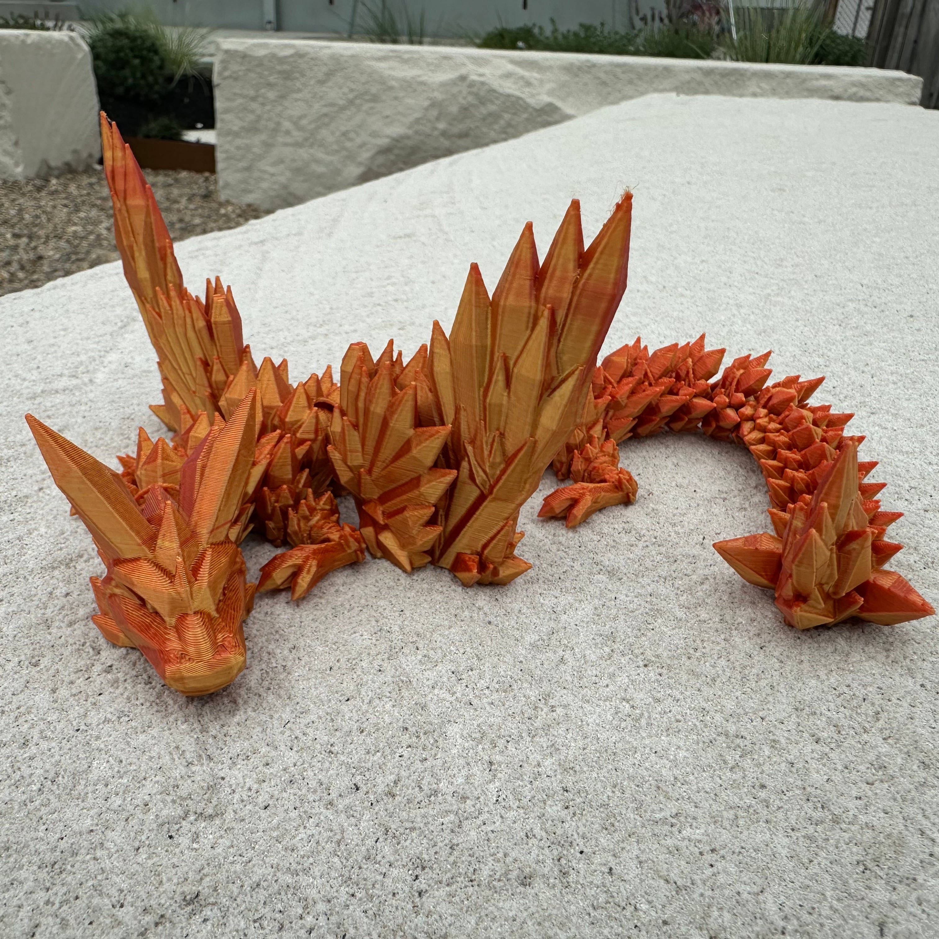 Crystal Winged Dragon Red/Gold on rock ledge