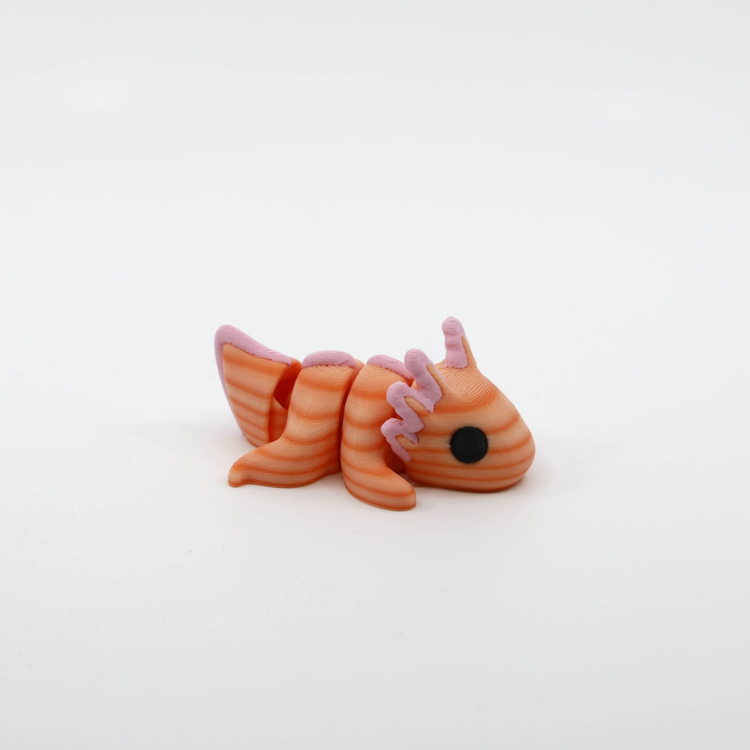 Side profile of the Mini Axolotl Fidget showing articulated body segments