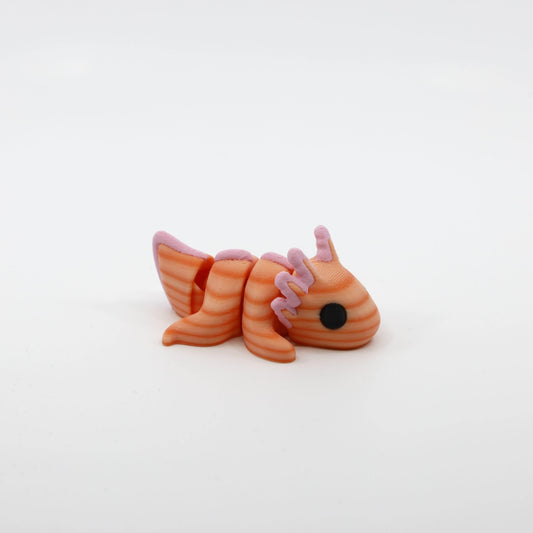 Side profile of the Mini Axolotl Fidget showing articulated body segments