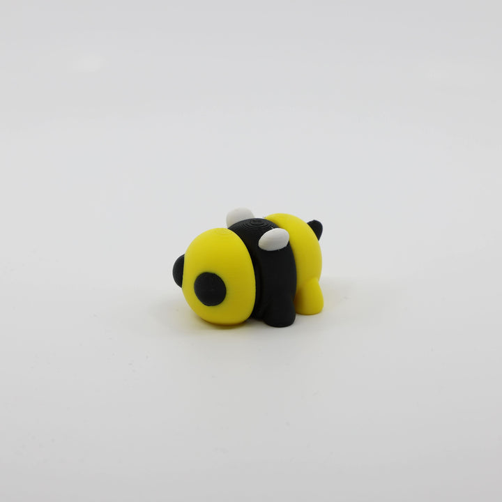 Side profile of articulated bee sensory fidget highlighting body segments and wings.