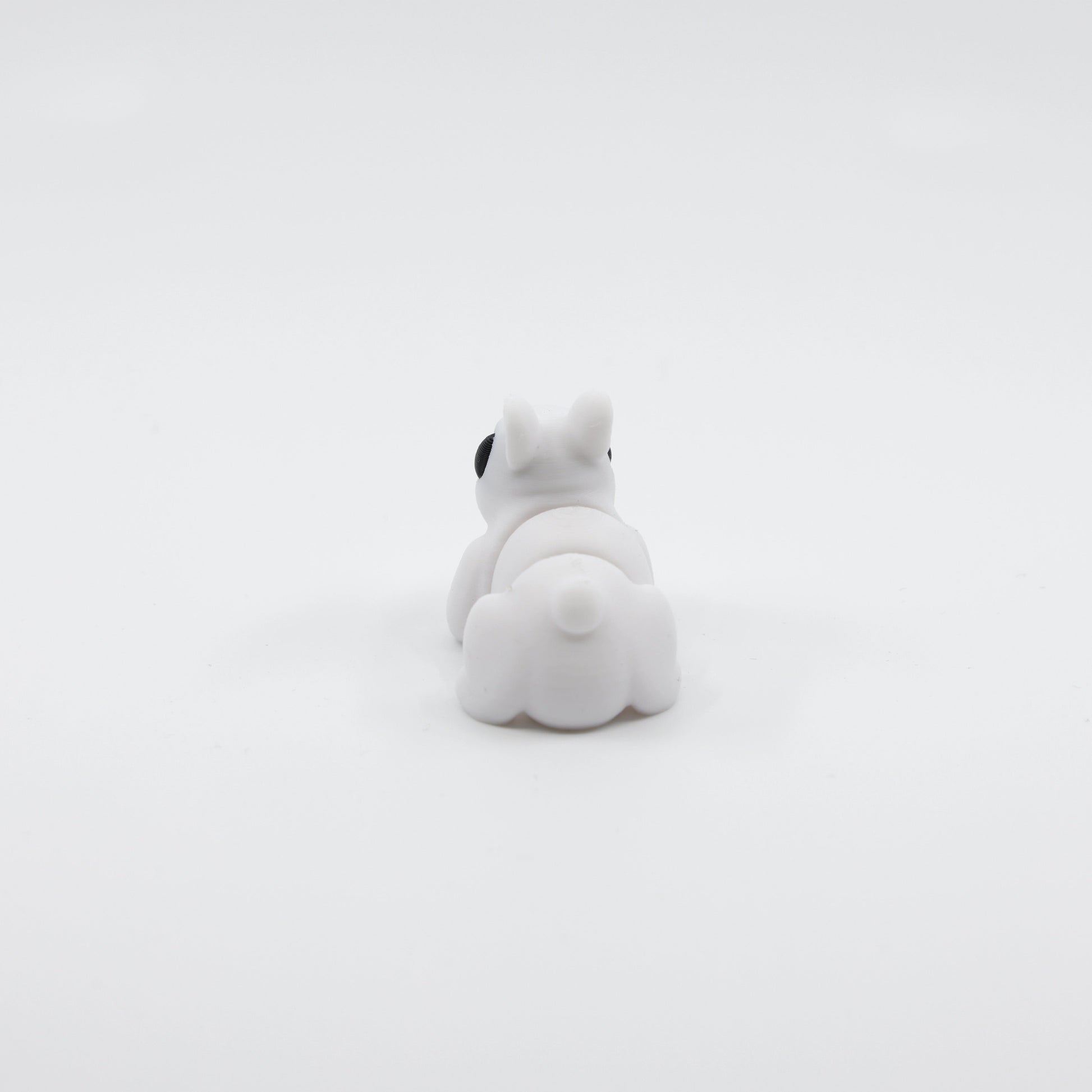 Back view of 3D printed articulated bunny fidget showing segmented body and tail detail