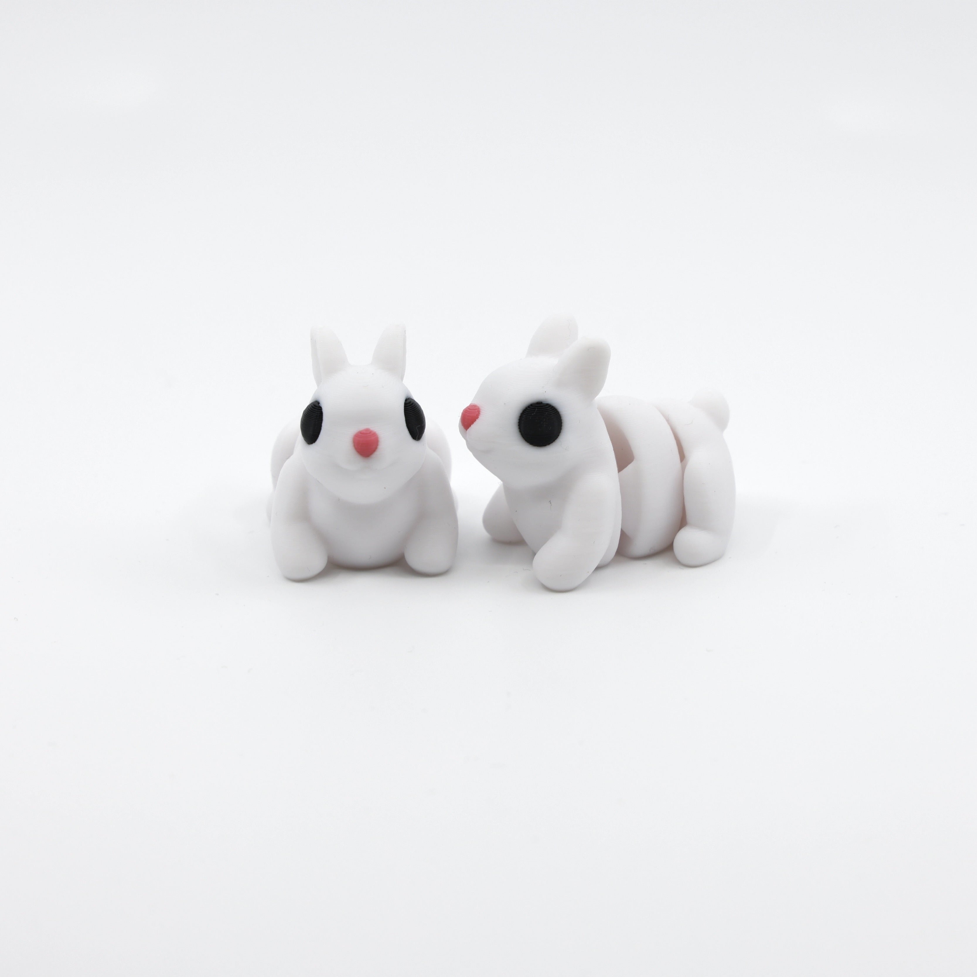 Two articulated bunny fidgets displayed together, showcasing sensory-friendly design and adorable detail