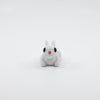 Front view of articulated mini bunny sensory fidget with cute facial features