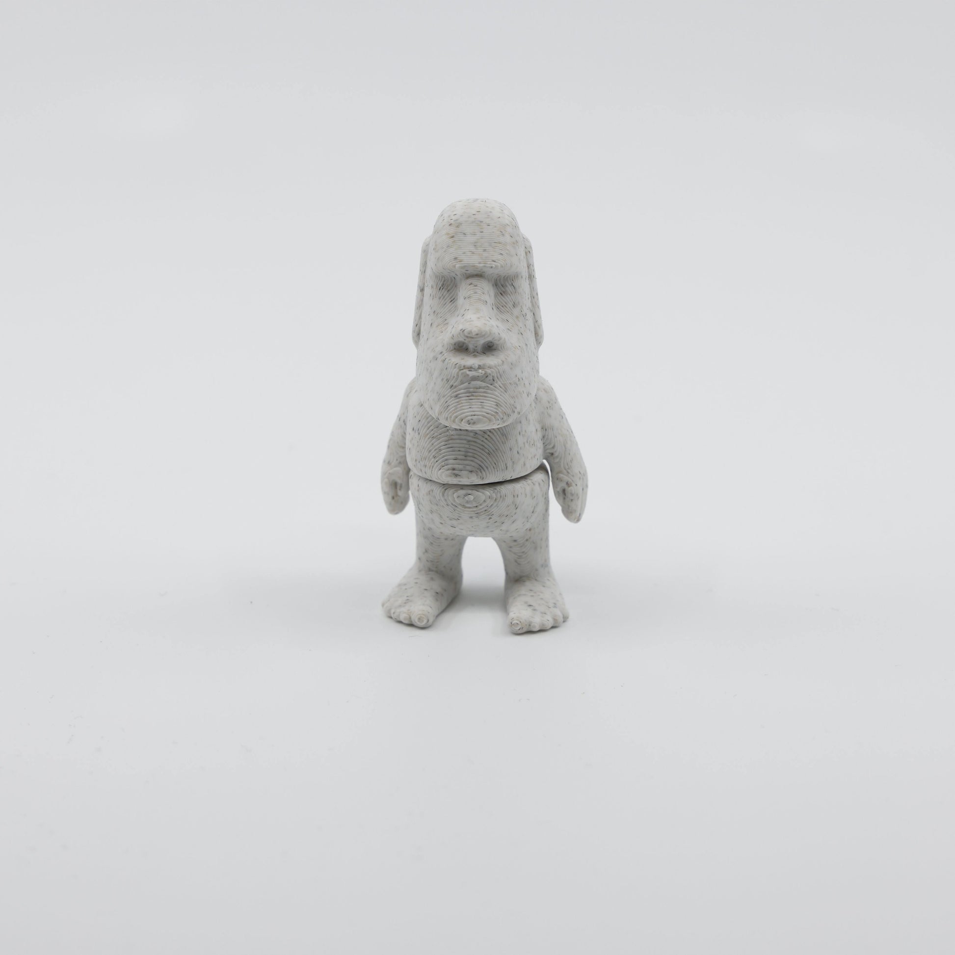 Front view of articulated mini Moai sensory fidget with detailed facial features and 3D printed design