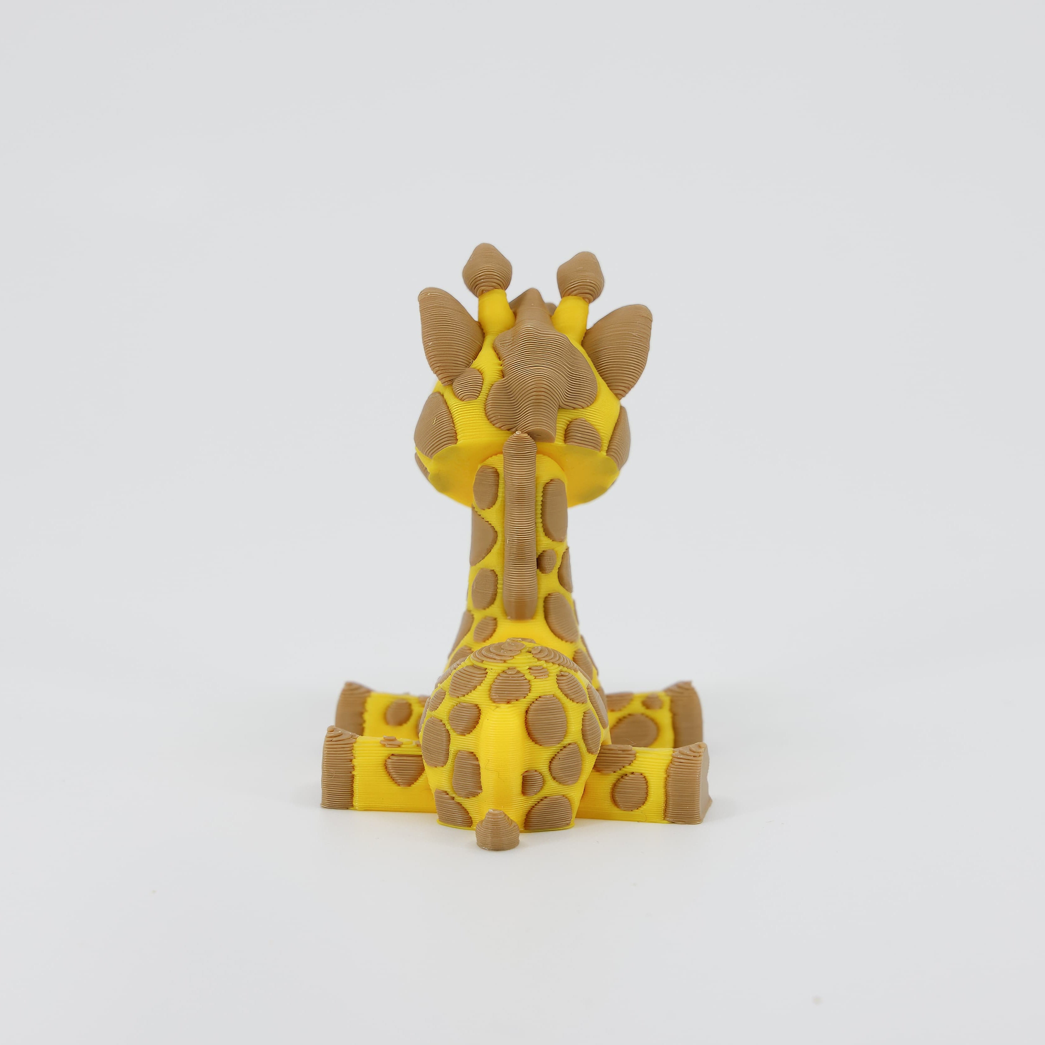 Back view of the miniature 3D printed Giraffe Wiggle Bud toy. Highlights the interlocking segments of the spine and tail, enabling the signature wiggle action.