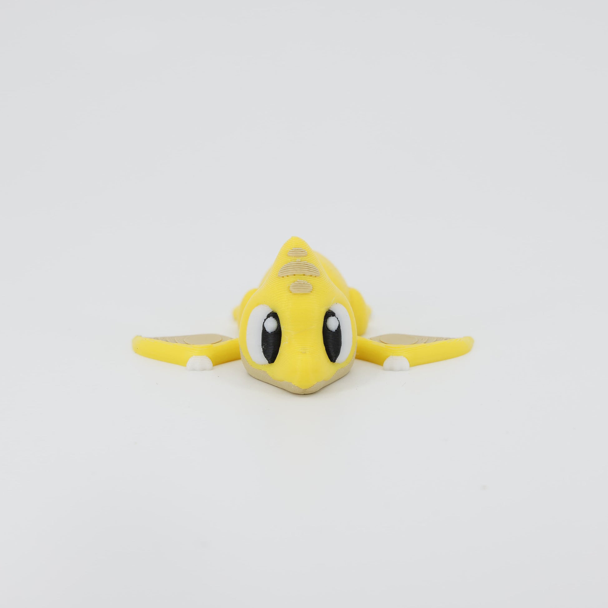 Front view of the Mini Pterodactyl Wiggle Bud fidget toy. Highlights the pointed beak and articulated wings created via 3D printing.