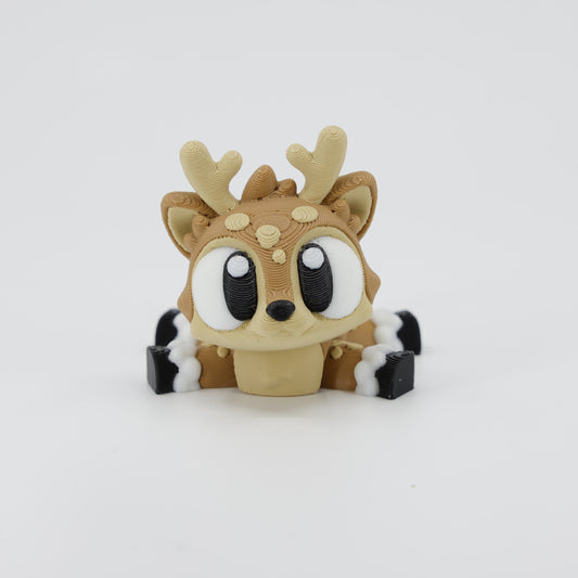 Front view of the Mini Reindeer Wiggle Bud fidget toy. Highlights the large antlers and articulated legs created via 3D printing.
