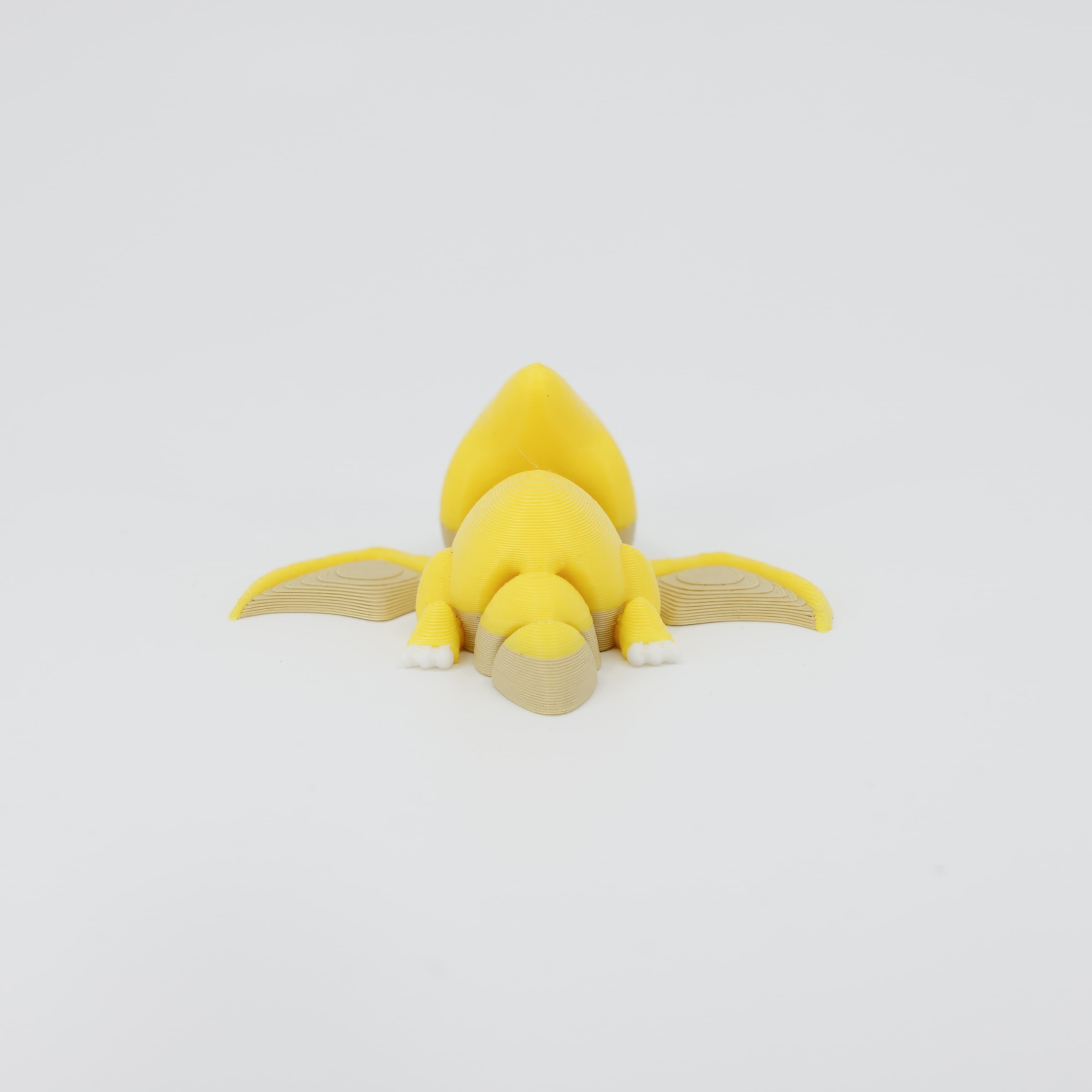 Back detail of the sensory 3D printed mini Pterodactyl, emphasizing the smooth wing texture designed for fidget play.