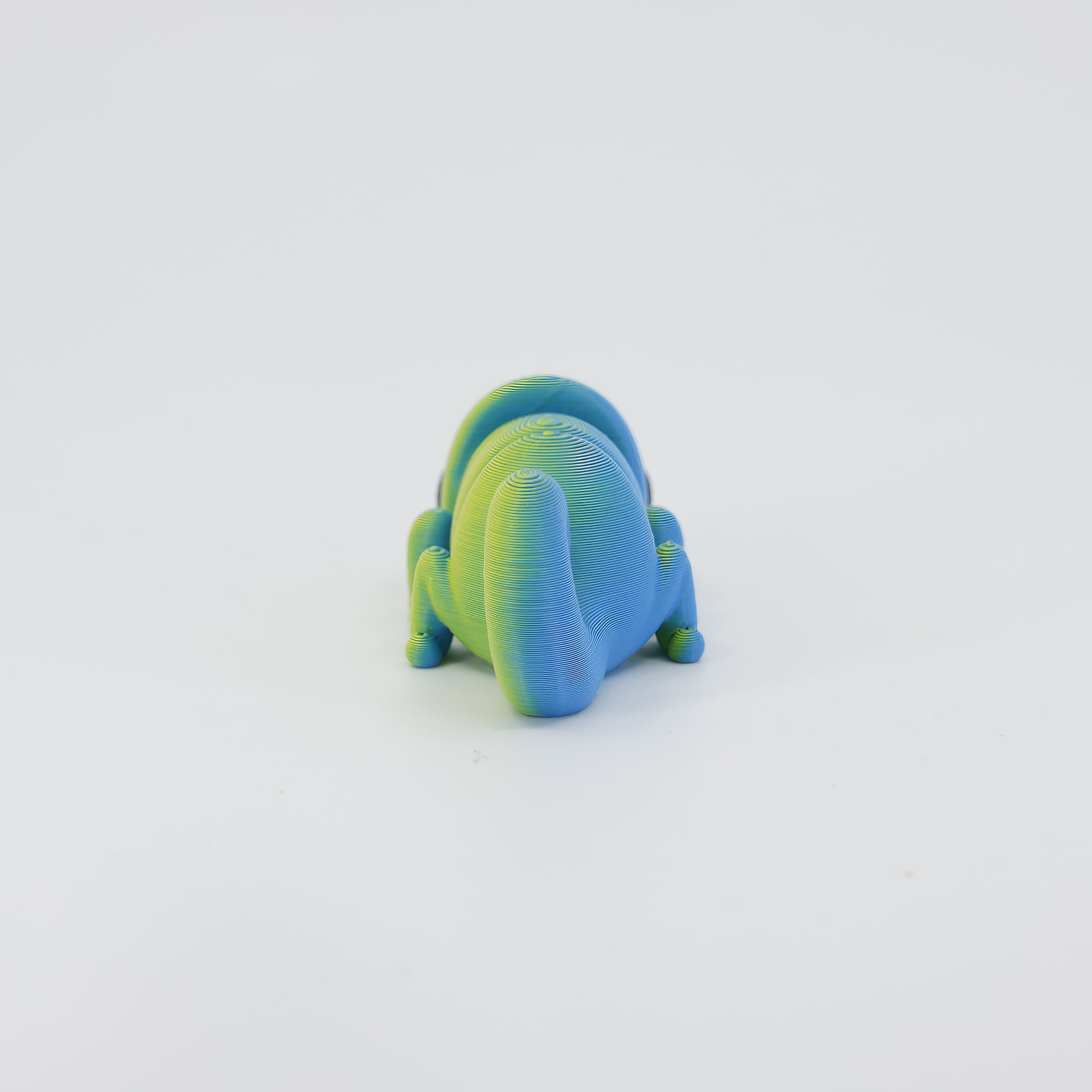 Back detail of the sensory 3D printed mini chameleon, emphasizing the smooth spine texture designed for fidget play.