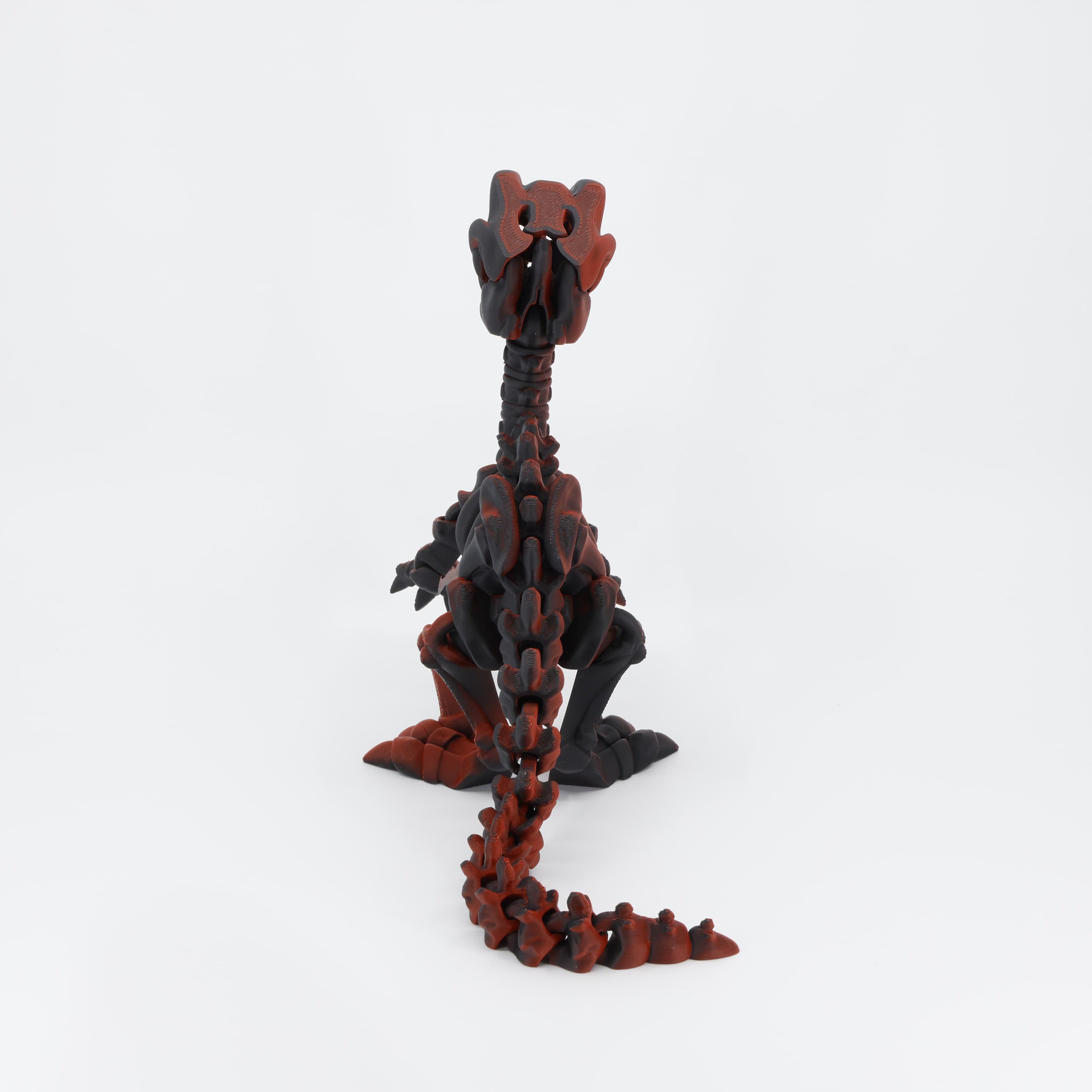 Back detail of the sensory 3D printed dinosaur skeleton, clearly showing the segmented joints designed for full fidget action.