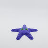 Front view of 3D printed flexi starfish fidget with articulated arms in purple