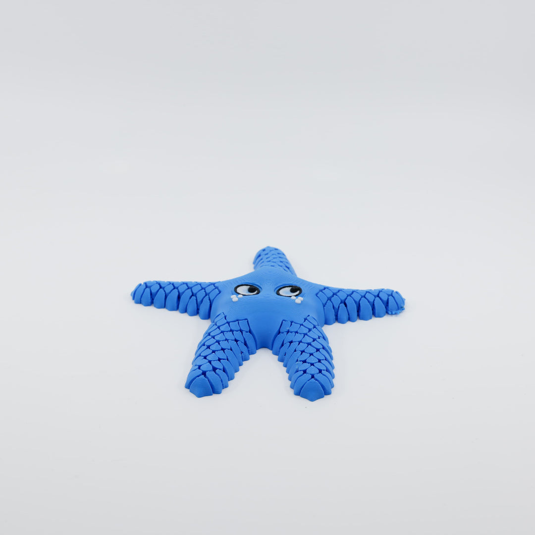 Front view of 3D printed flexi starfish fidget with articulated arms