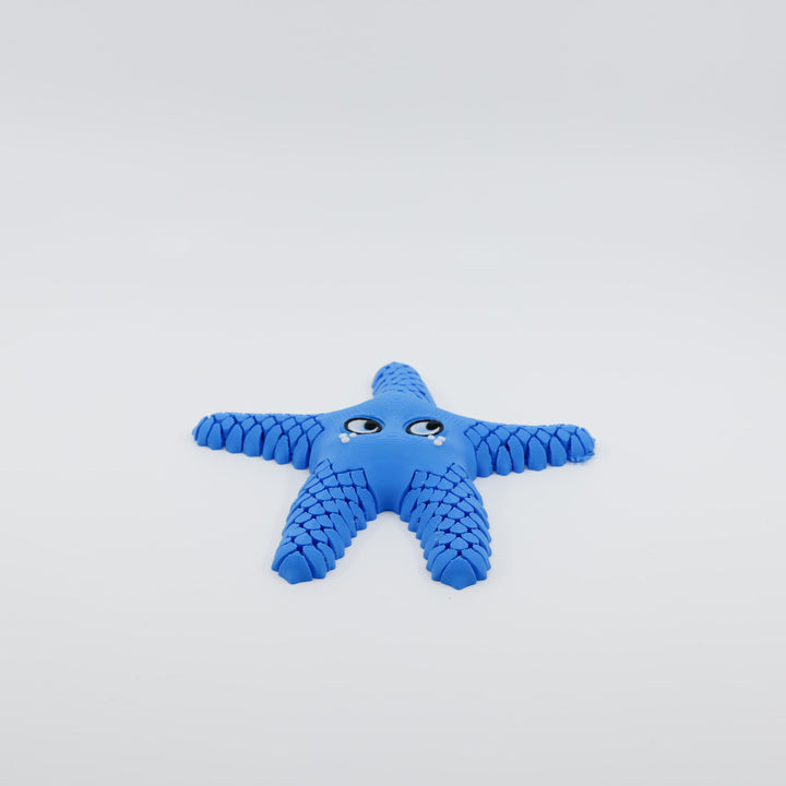 Front view of 3D printed flexi starfish fidget with articulated arms