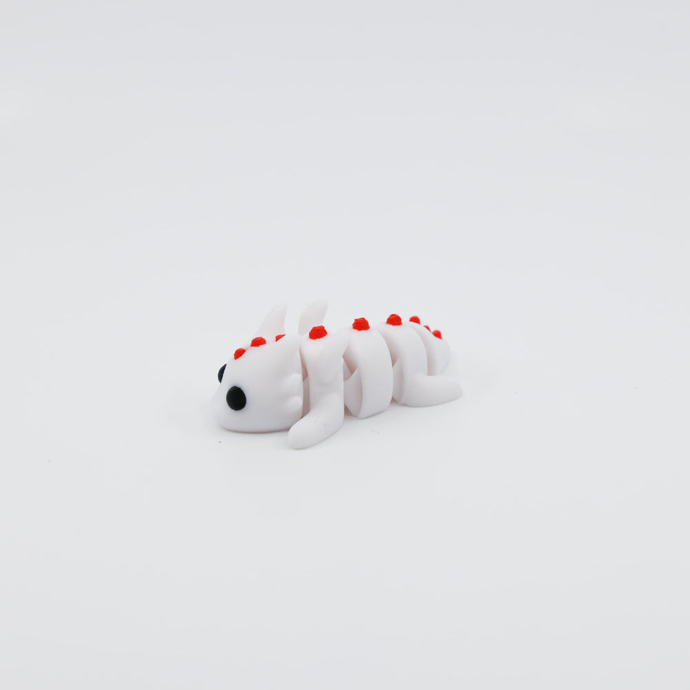 Side view of articulated mini dragon fidget toy
