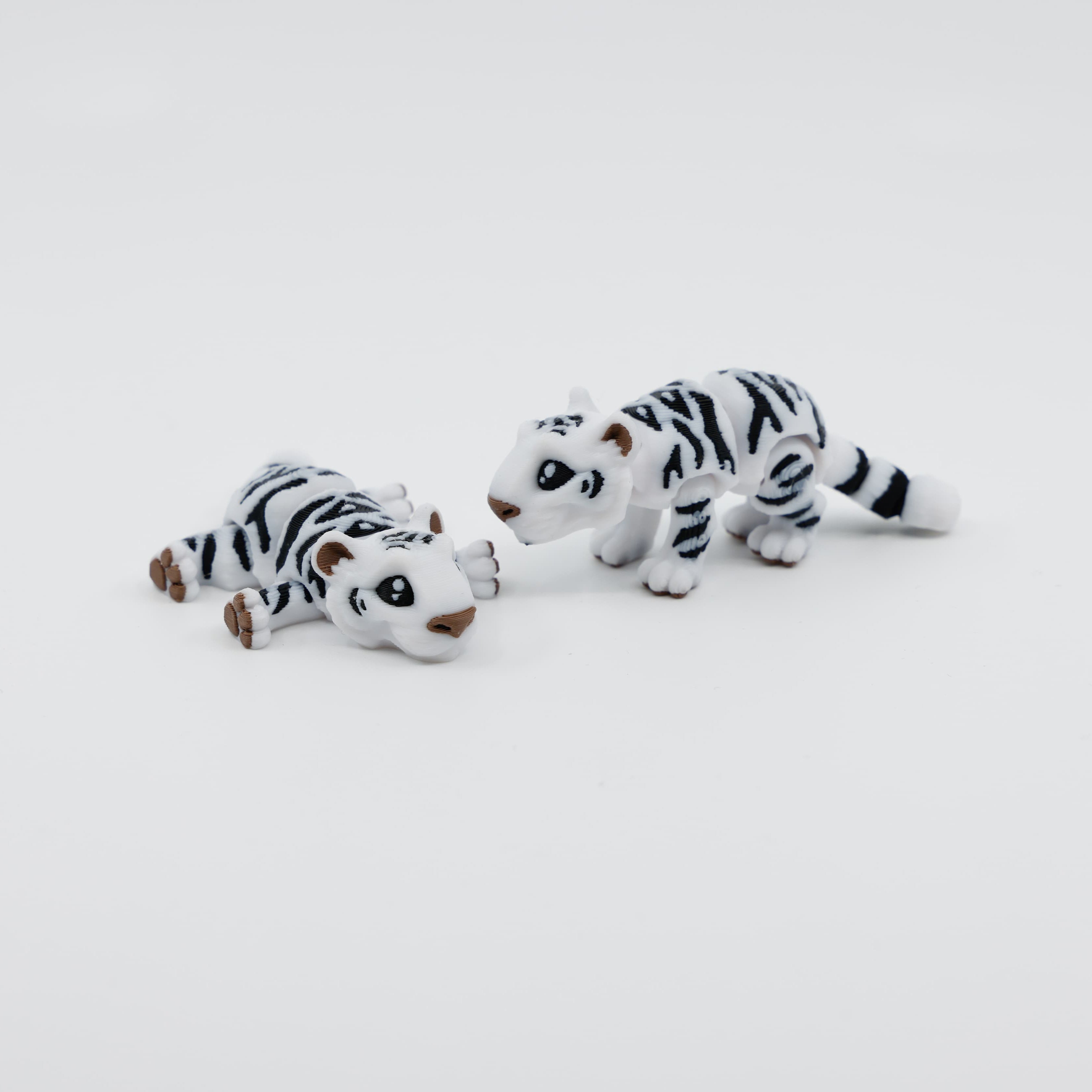 Group of mini snow tiger fidgets in different poses